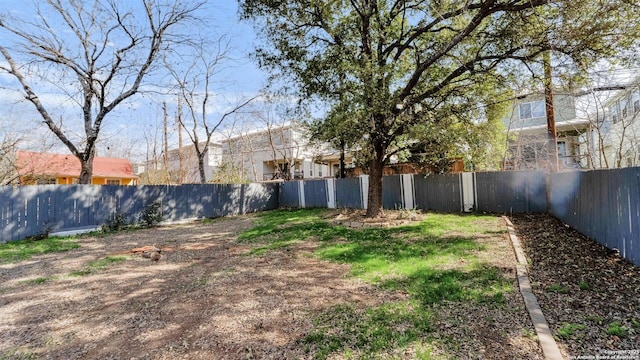 view of yard featuring a fenced backyard