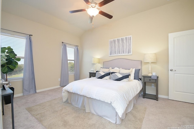 bedroom featuring a ceiling fan, lofted ceiling, carpet flooring, and baseboards