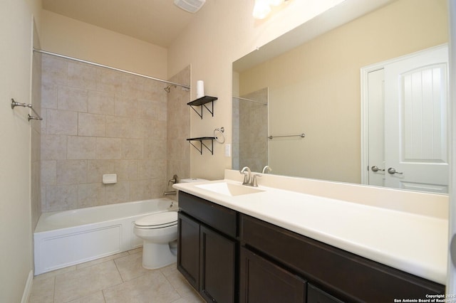 bathroom featuring toilet, visible vents, vanity,  shower combination, and tile patterned floors