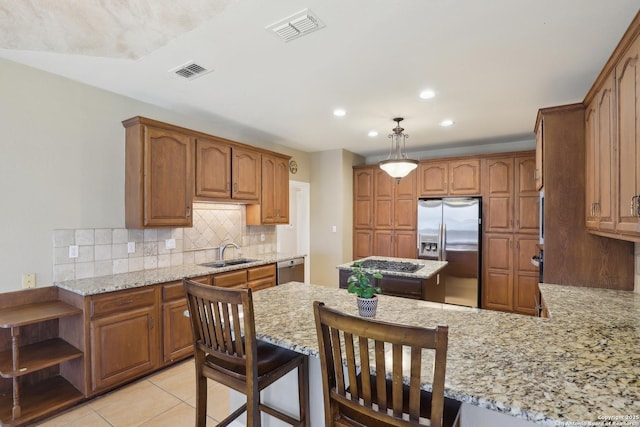 17110 Eagle Holw, San Antonio, TX 78248 - kitchen featuring tasteful backsplash, visible vents, stainless steel appliances, and a sink