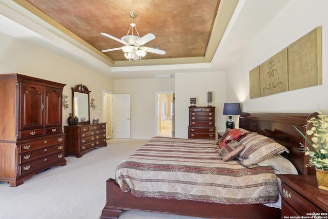 17110 Eagle Holw, San Antonio, TX 78248 - bedroom featuring ensuite bathroom, a raised ceiling, a ceiling fan, and light colored carpet