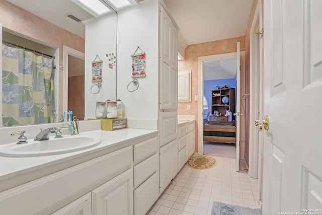 17110 Eagle Holw, San Antonio, TX 78248 - bathroom with a skylight, visible vents, ensuite bathroom, tile patterned flooring, and vanity