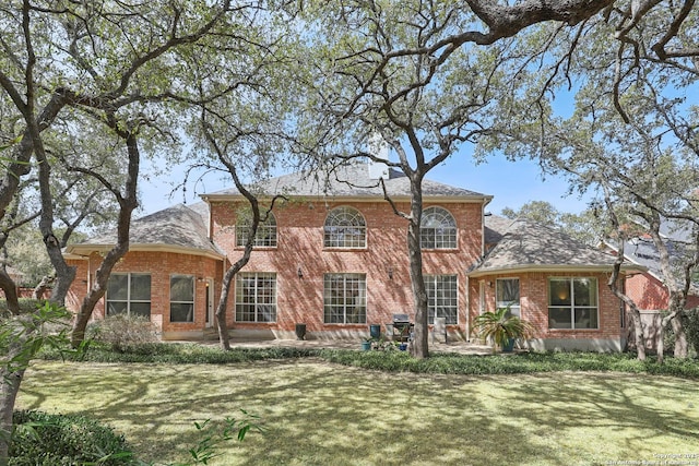 17110 Eagle Holw, San Antonio, TX 78248 - view of front of home featuring a front yard, a patio area, and brick siding