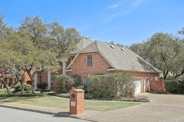 17110 Eagle Holw, San Antonio, TX 78248 - view of front facade with driveway, brick siding, roof with shingles, and a front yard