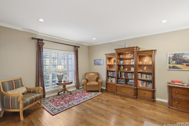 17110 Eagle Holw, San Antonio, TX 78248 - living area featuring crown molding, baseboards, and wood finished floors