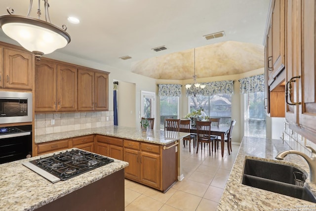 17110 Eagle Holw, San Antonio, TX 78248 - kitchen with black appliances, visible vents, vaulted ceiling, and a sink
