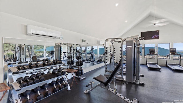 gym with high vaulted ceiling and an AC wall unit