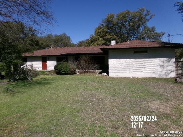 exterior space with a lawn