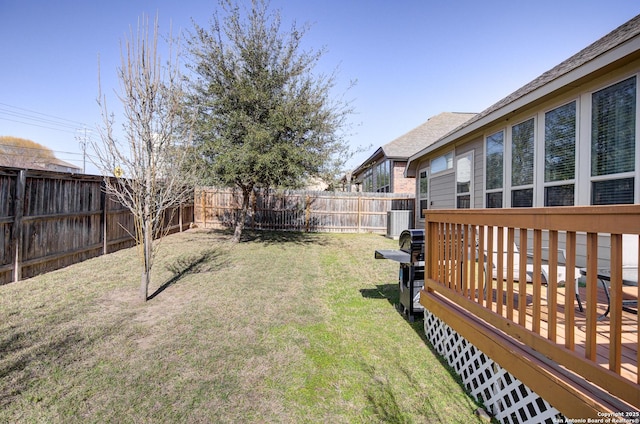 view of yard featuring cooling unit, a fenced backyard, and a deck