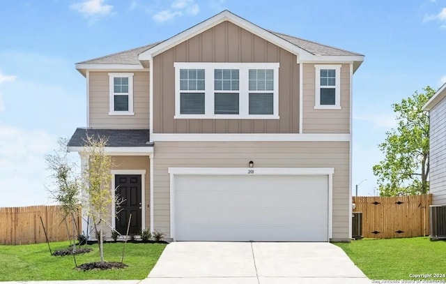 view of front of property featuring driveway, board and batten siding, an attached garage, and fence