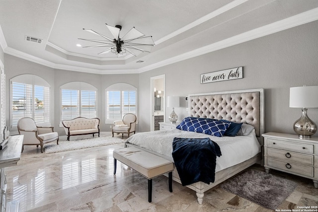 404 Matern Ct, Horseshoe Bay, TX 78657 - bedroom with a tray ceiling, crown molding, visible vents, ensuite bathroom, and an inviting chandelier