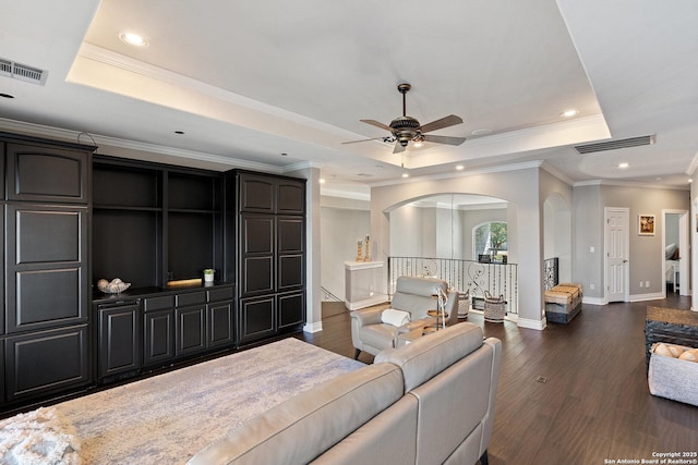 404 Matern Ct, Horseshoe Bay, TX 78657 - living area with visible vents, a tray ceiling, and dark wood-type flooring