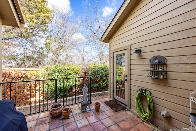 view of patio / terrace featuring fence and grilling area