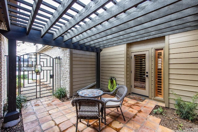 view of patio / terrace with a gate and a pergola