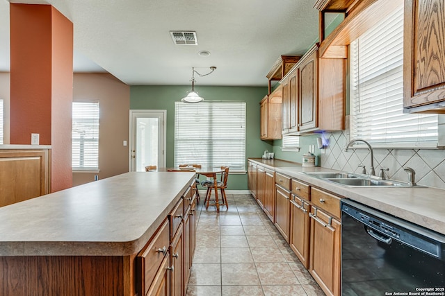 kitchen with light tile patterned floors, black dishwasher, tasteful backsplash, visible vents, and a sink