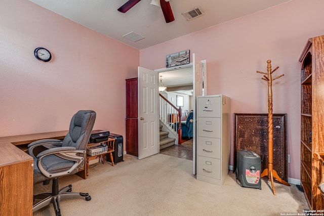 carpeted home office featuring ceiling fan and visible vents