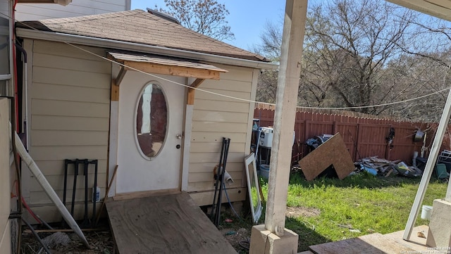 view of outbuilding with fence