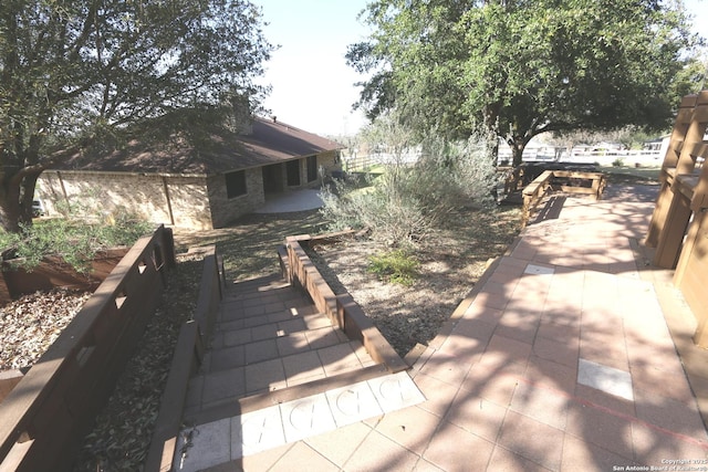 wooden deck with a patio area