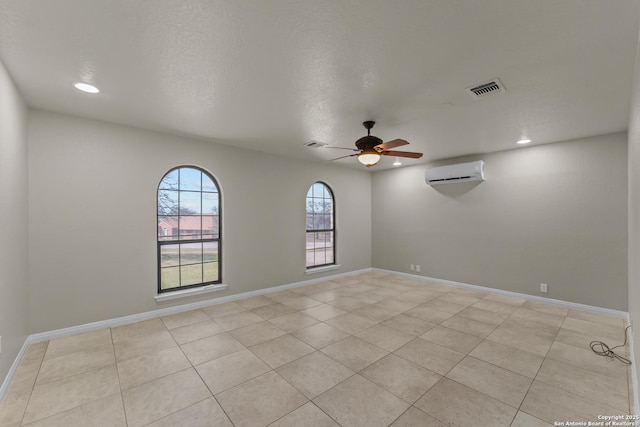 1300 Windmill Dr, La Vernia, TX 78121 - spare room featuring baseboards, visible vents, recessed lighting, ceiling fan, and a wall mounted air conditioner