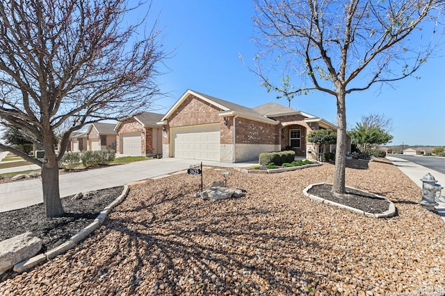 ranch-style home featuring concrete driveway, brick siding, and an attached garage