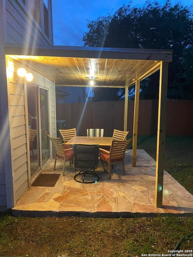 view of patio / terrace with outdoor dining space and fence