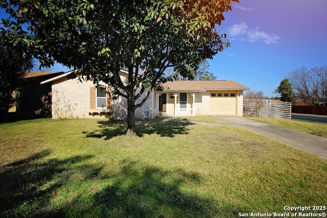 ranch-style house featuring brick siding, fence, a garage, driveway, and a front lawn