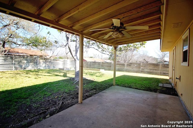 view of patio / terrace featuring ceiling fan, a fenced backyard, and an outdoor structure