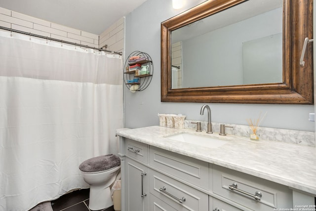 full bath with vanity and toilet