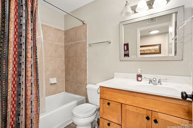 full bath with visible vents, vanity, shower / bath combination with curtain, and toilet