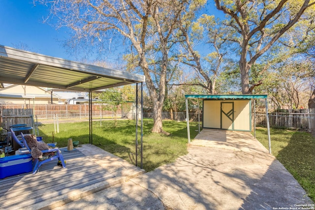 view of patio / terrace featuring a shed, a fenced backyard, and an outbuilding