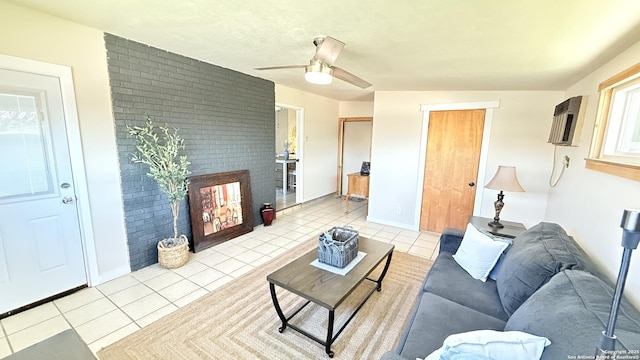 living room with a ceiling fan, light tile patterned flooring, a fireplace, and a wall unit AC