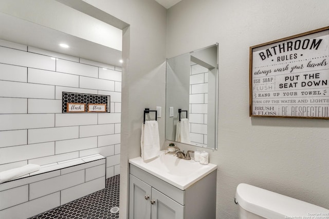 bathroom featuring toilet and vanity