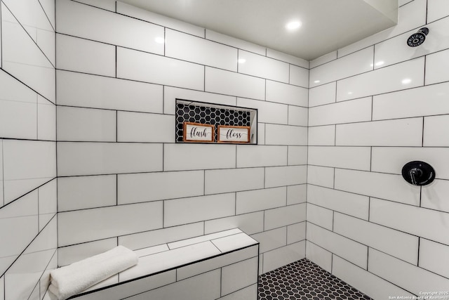 bathroom featuring tiled shower