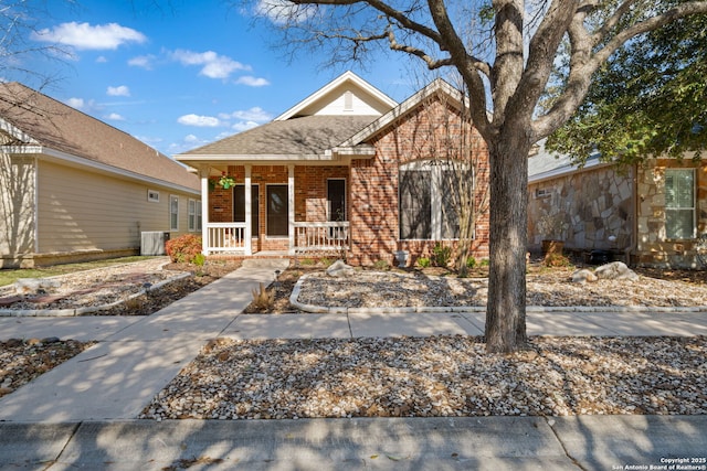 view of front of house with brick siding and covered porch