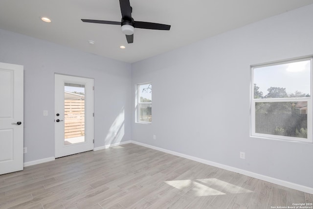 unfurnished room with recessed lighting, ceiling fan, light wood finished floors, and baseboards