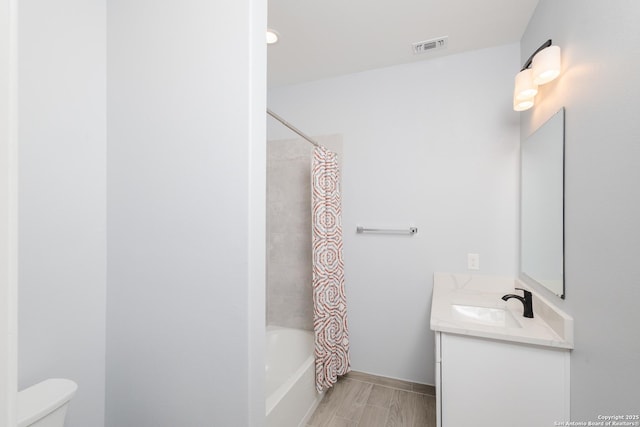 bathroom with visible vents, shower / bath combination with curtain, vanity, and toilet