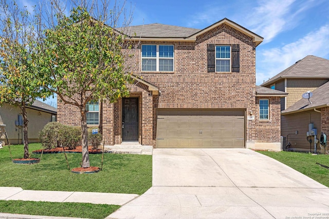 traditional-style house with driveway, a garage, a front yard, and brick siding