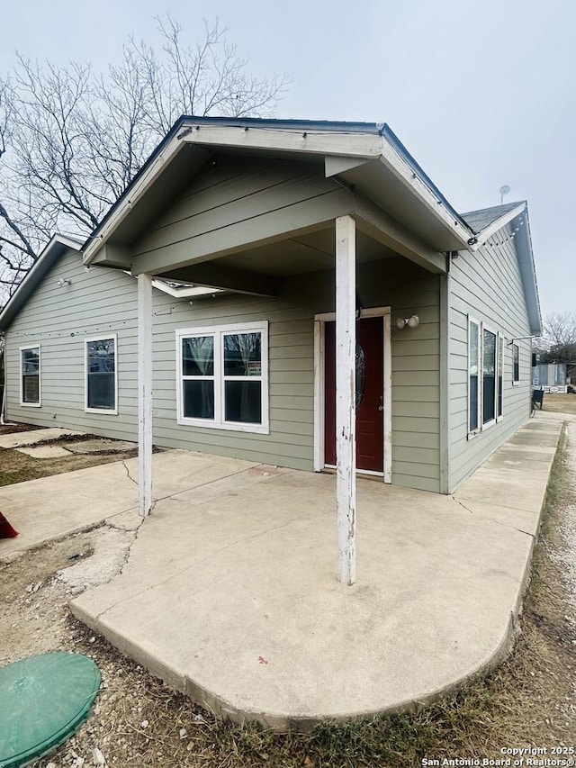 back of property featuring a patio area