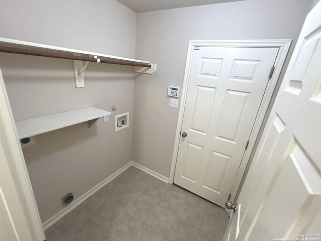 laundry area featuring light tile patterned floors, hookup for a gas dryer, laundry area, washer hookup, and baseboards