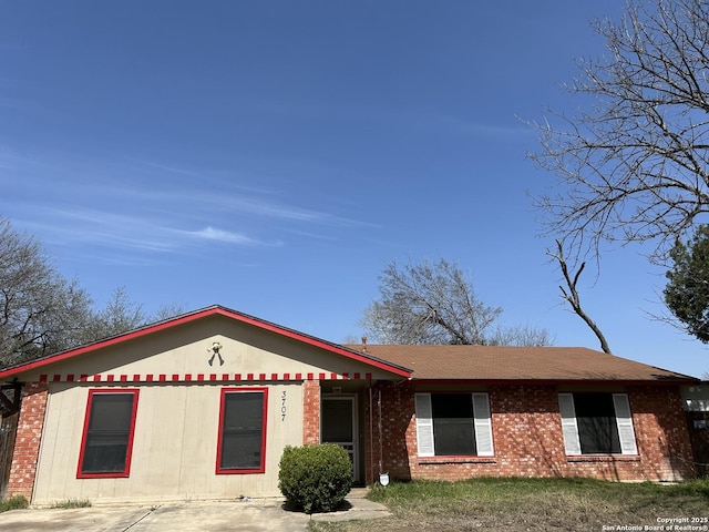 ranch-style house with brick siding