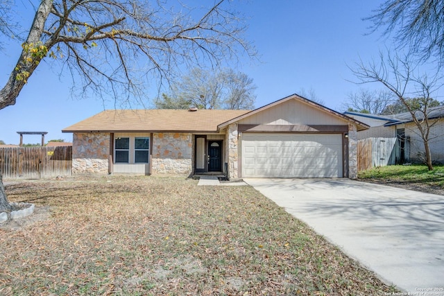 single story home featuring a garage, stone siding, fence, and driveway