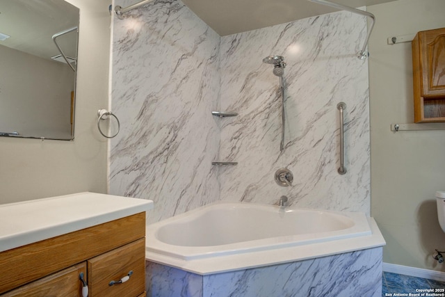 bathroom featuring toilet, vanity, and a combined bath / shower with marble appearance