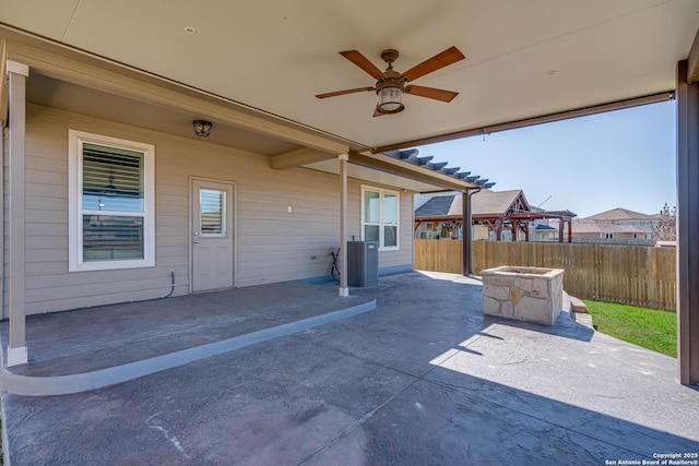 view of patio featuring central AC unit, fence, and a ceiling fan