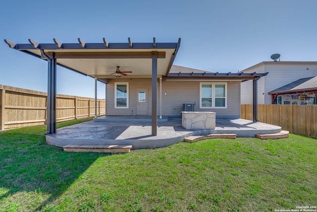 back of property featuring a patio area, a fenced backyard, a ceiling fan, and a lawn