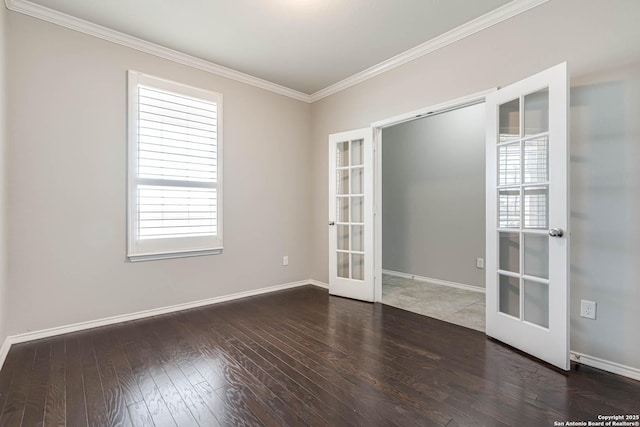 unfurnished room with ornamental molding, french doors, hardwood / wood-style floors, and baseboards