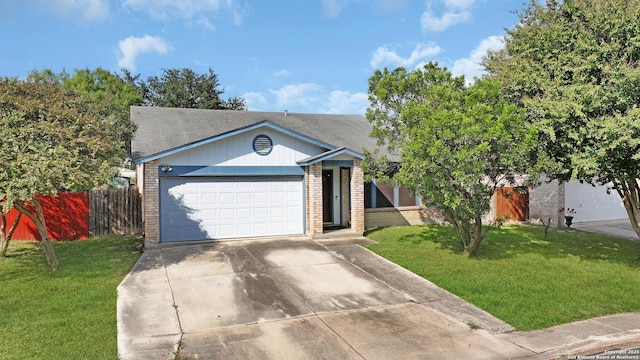 view of front facade featuring a garage, a front yard, concrete driveway, and brick siding