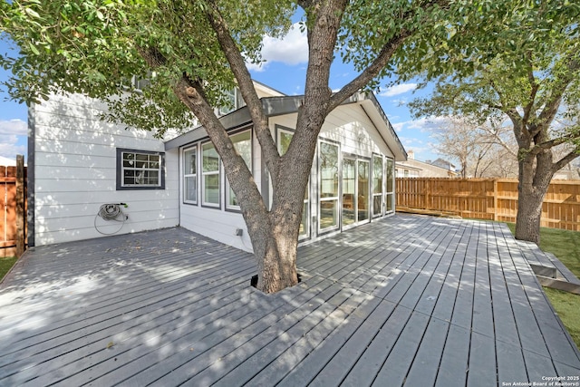 deck with a fenced backyard