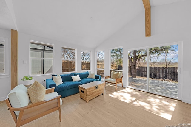 sunroom / solarium with vaulted ceiling