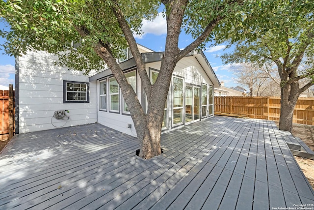 wooden terrace featuring fence private yard