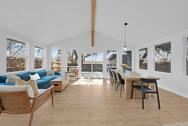 sunroom with lofted ceiling with beams